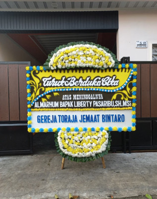 Papan Bunga Duka di Karu